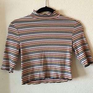 Lettuce ribbed turtle neck 3/4 sleeve crop top.
